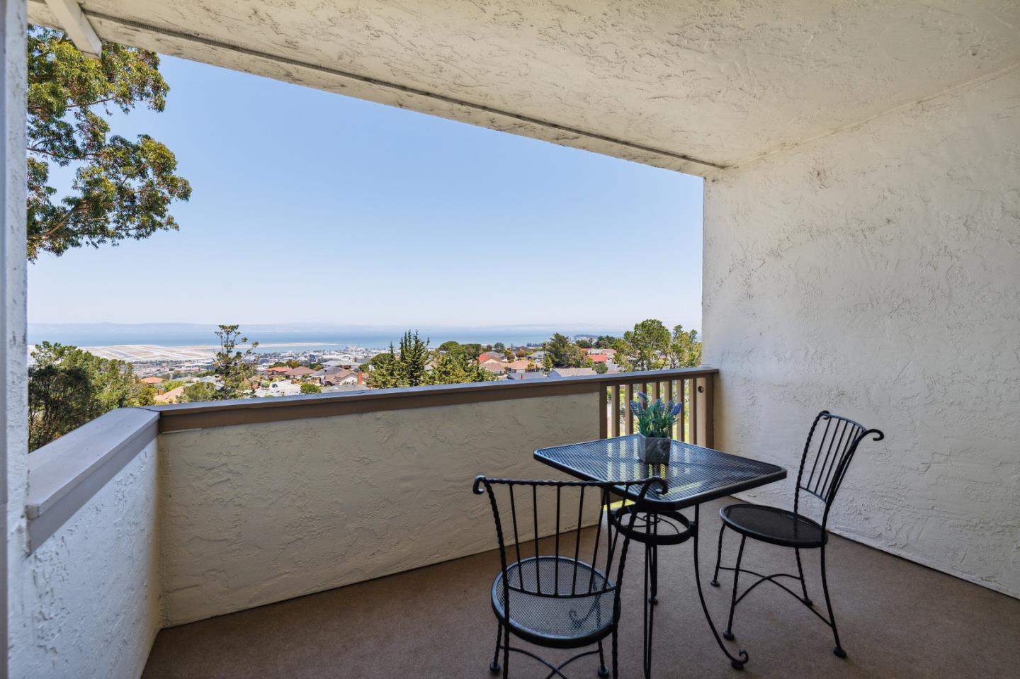 360 Vallejo Drive, Unit 113 Millbrae, CA 94030 - Photo 21 of 34 a view of a chairs and table on the terrace