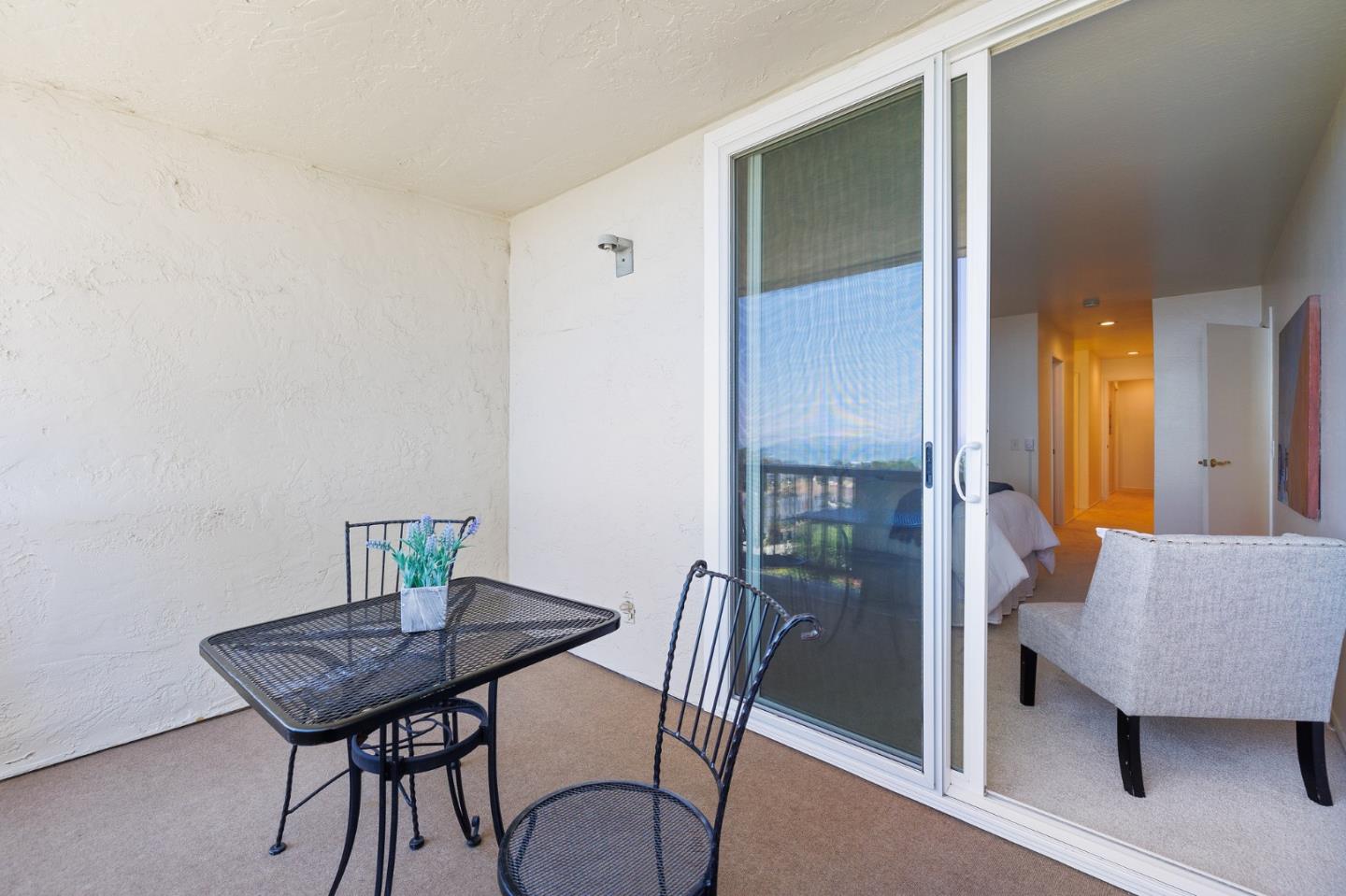 360 Vallejo Drive, Unit 113 Millbrae, CA 94030 - Photo 23 of 34 a view of a room with furniture and wooden floor