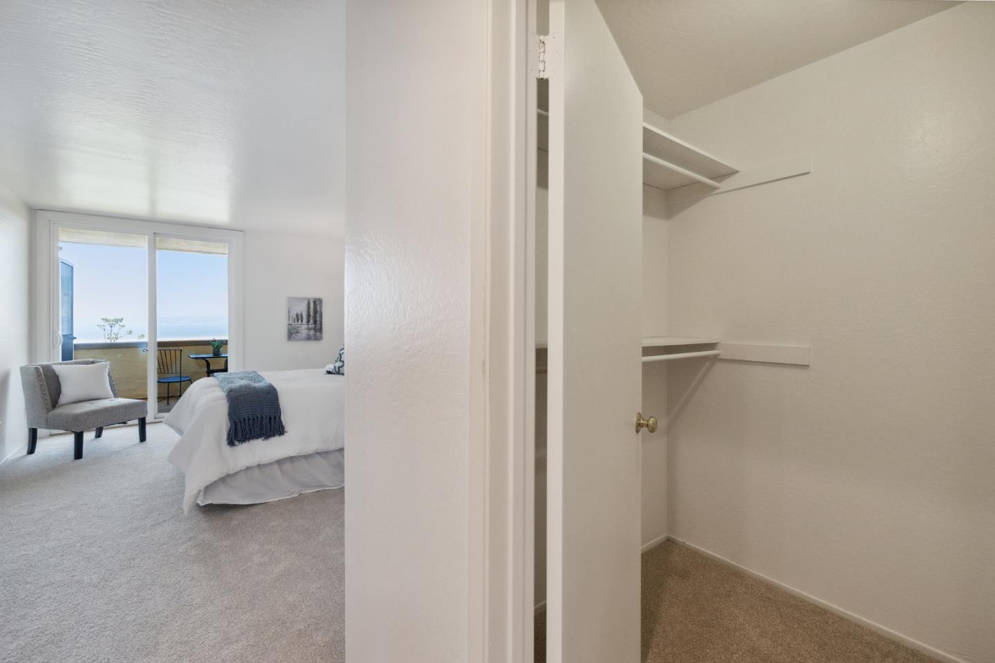 360 Vallejo Drive, Unit 113 Millbrae, CA 94030 - Photo 26 of 34 a bedroom with a bed and a chair
