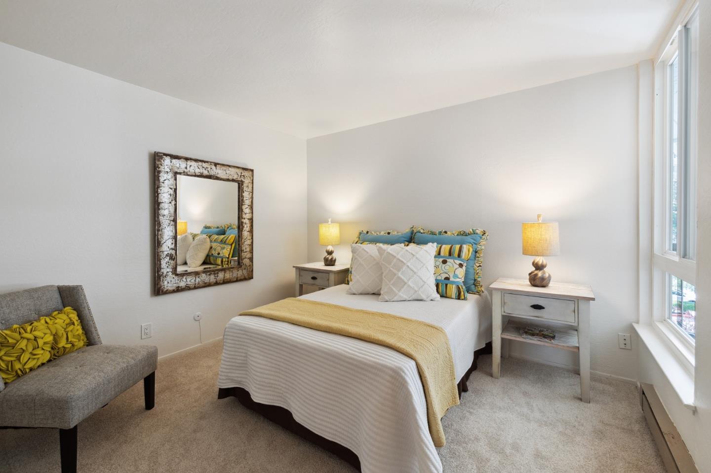 360 Vallejo Drive, Unit 113 Millbrae, CA 94030 - Photo 29 of 34 a bedroom with a bed and a couch