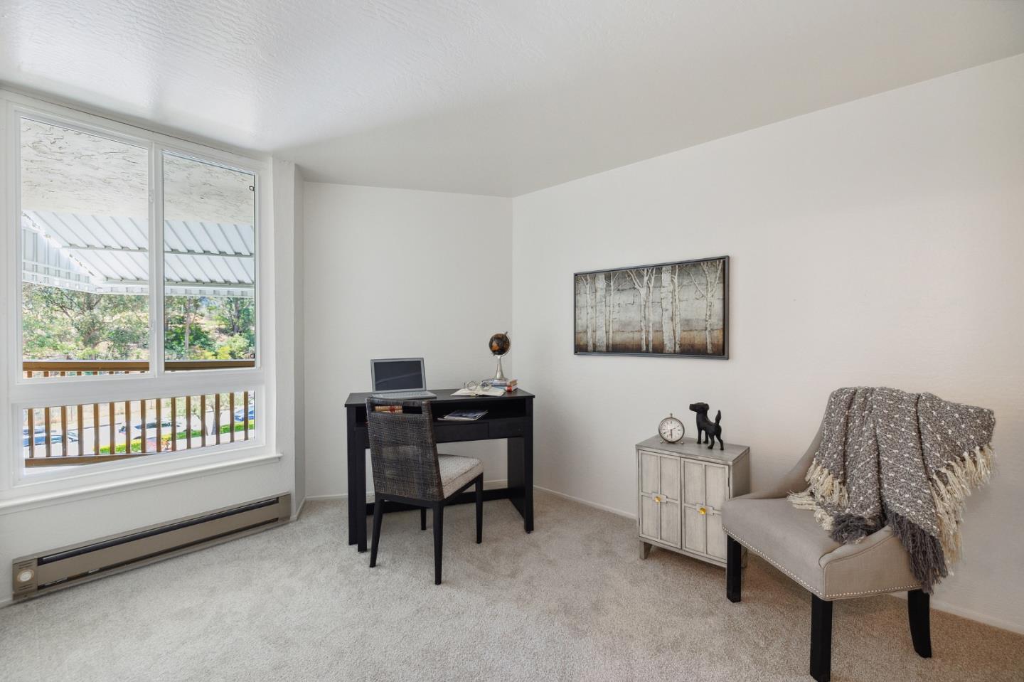 360 Vallejo Drive, Unit 113 Millbrae, CA 94030 - Photo 31 of 34 a living room with furniture and a window