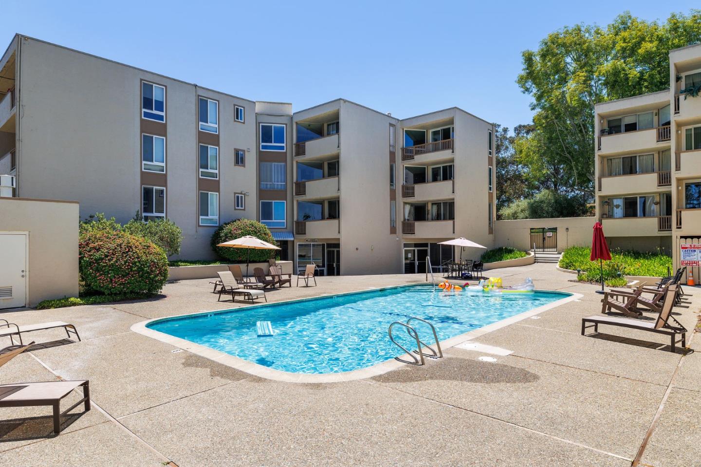 360 Vallejo Drive, Unit 113 Millbrae, CA 94030 - Photo 6 of 34 a view of a building with garden and sitting area