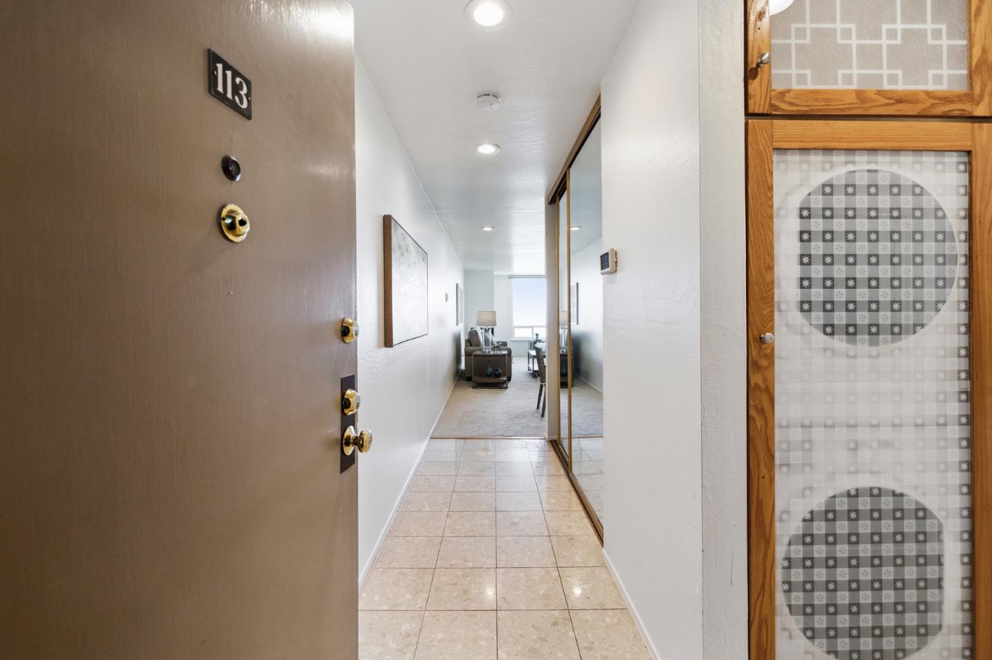 360 Vallejo Drive, Unit 113 Millbrae, CA 94030 - Photo 8 of 34 a view of a hallway with windows