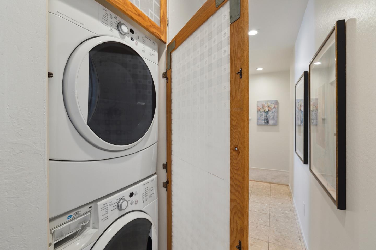 360 Vallejo Drive, Unit 113 Millbrae, CA 94030 - Photo 9 of 34 a view of a hallway with washer and dryer