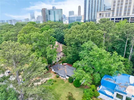 an aerial view of a building with garden and plants