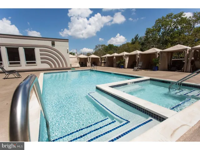 a view of swimming pool from a balcony