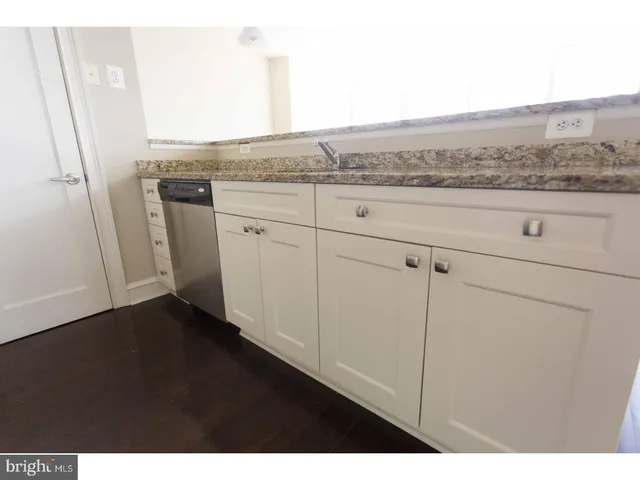 a view of cabinets with wooden floor