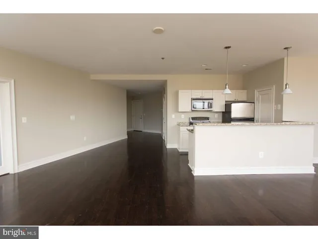 a view of a kitchen with a sink