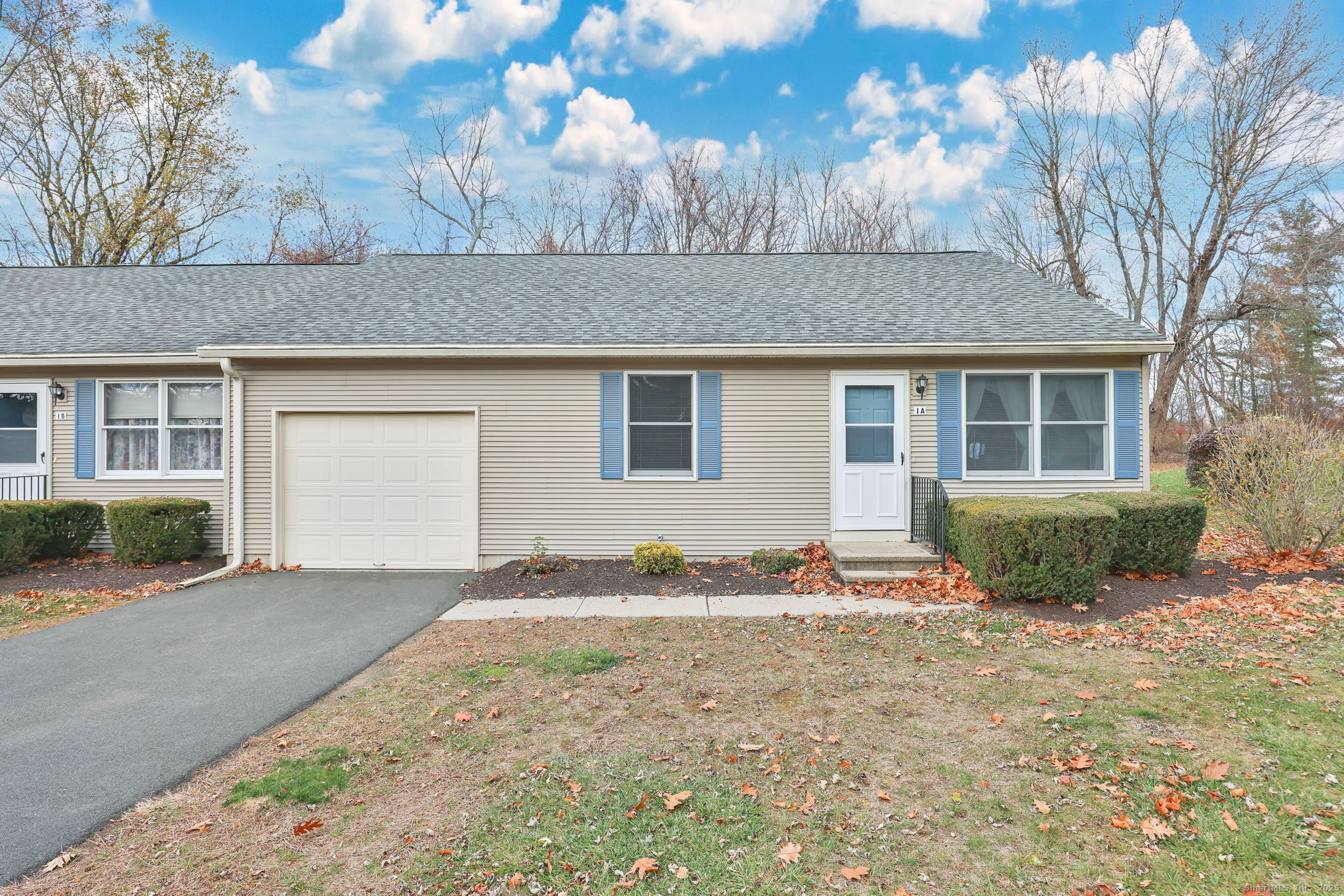 102 North Maple Street, Unit 1A Enfield, CT 06082 - Photo 1 of 1 a front view of a house with a yard