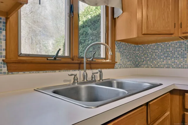 a view white cabinets and a sink