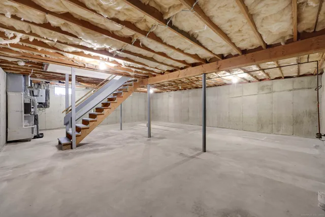 a view of an empty room with stairs