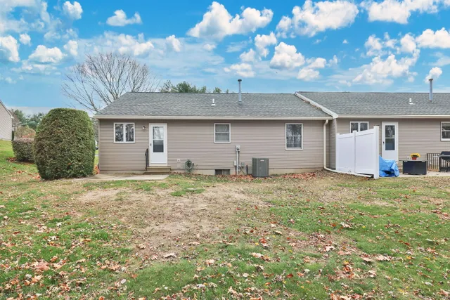 a view of a backyard with large trees