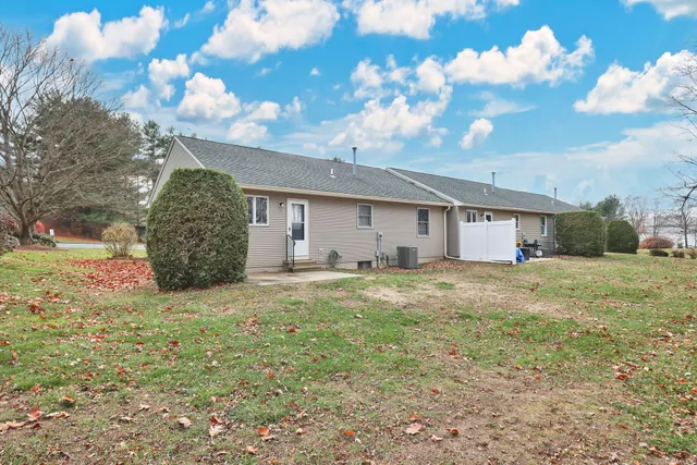 a view of a house with a backyard