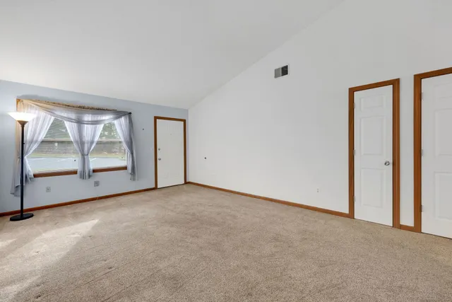 an empty room with a view of mirror