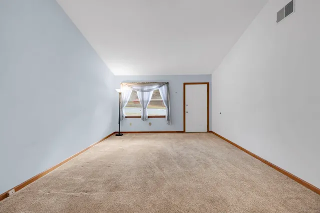 an empty room with windows