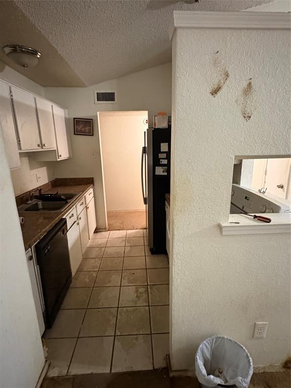 10339 Limestone Drive Dallas, TX 75217 - Photo 3 of 8 a kitchen with a sink a stove a refrigerator and cabinets
