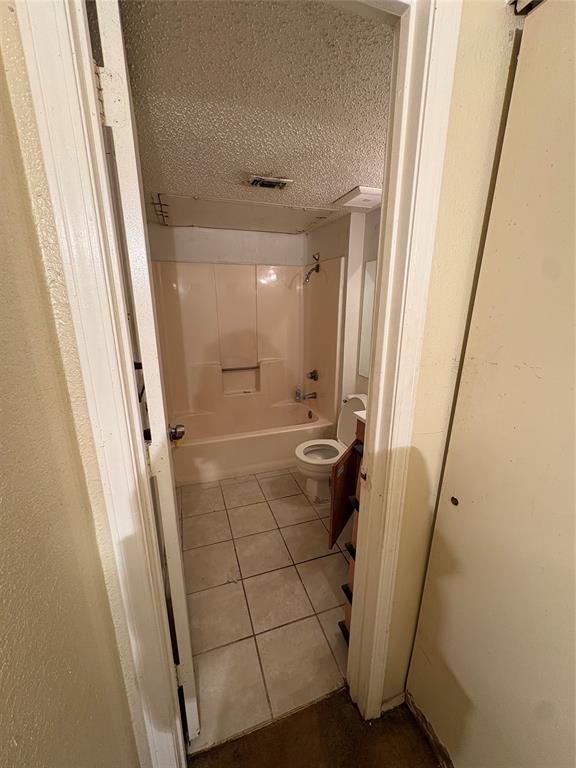 10339 Limestone Drive Dallas, TX 75217 - Photo 5 of 8 a bathroom with a sink a mirror and shower