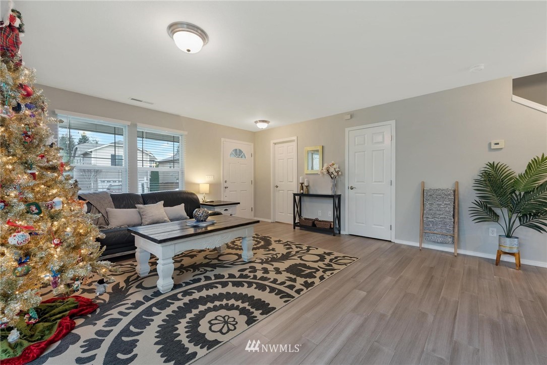 15429 38th Drive Southeast Bothell, WA 98012 - Photo 2 of 26 a living room with furniture and a potted plant