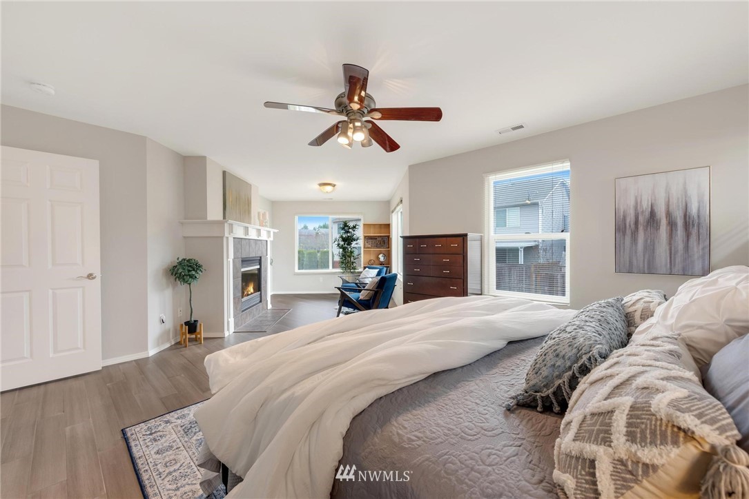 15429 38th Drive Southeast Bothell, WA 98012 - Photo 12 of 26 a spacious bedroom with a bed and ceiling fan