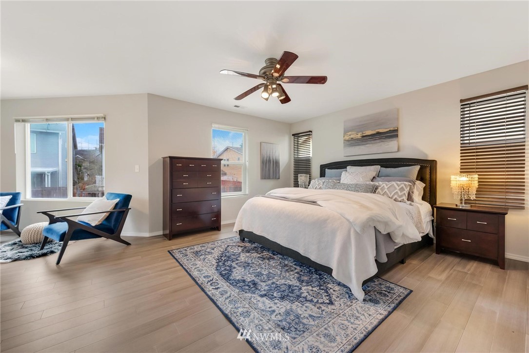 15429 38th Drive Southeast Bothell, WA 98012 - Photo 13 of 26 a bedroom with a bed and wooden floor