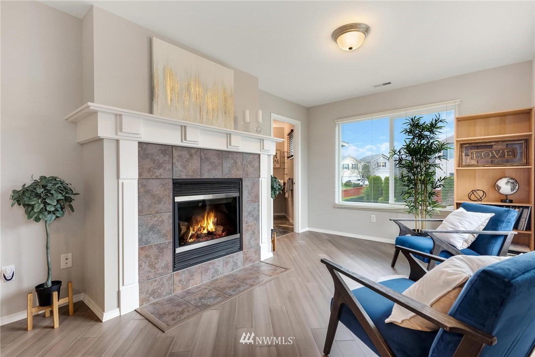 15429 38th Drive Southeast Bothell, WA 98012 - Photo 14 of 26 a living room with furniture and a fireplace