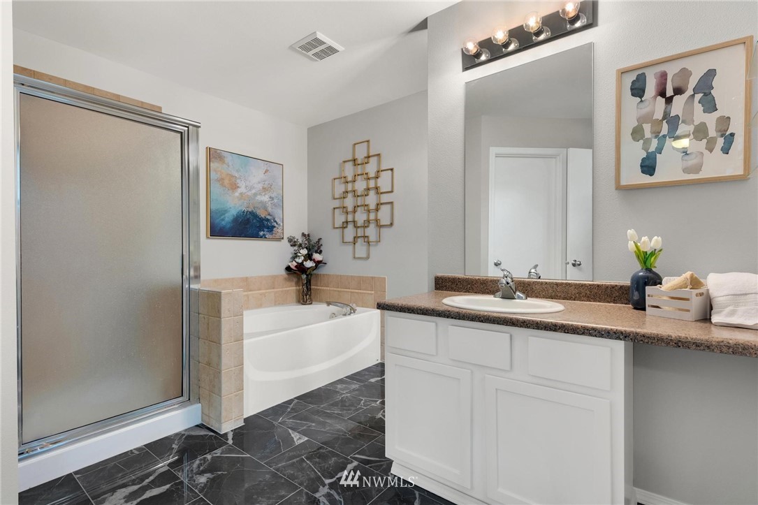 15429 38th Drive Southeast Bothell, WA 98012 - Photo 15 of 26 a bath room with a sink and a mirror