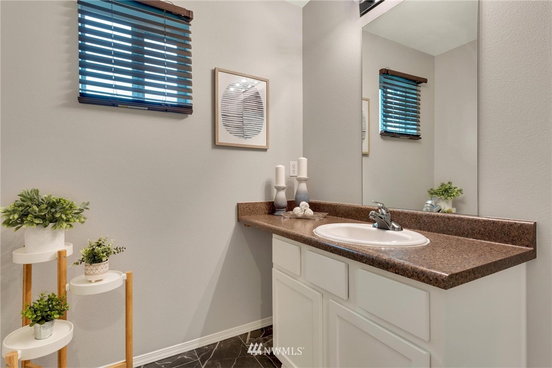 15429 38th Drive Southeast Bothell, WA 98012 - Photo 16 of 26 a bathroom with a sink and a toilet