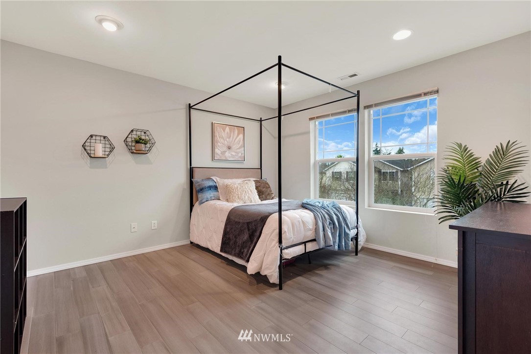 15429 38th Drive Southeast Bothell, WA 98012 - Photo 17 of 26 a spacious bedroom with a bed and a window