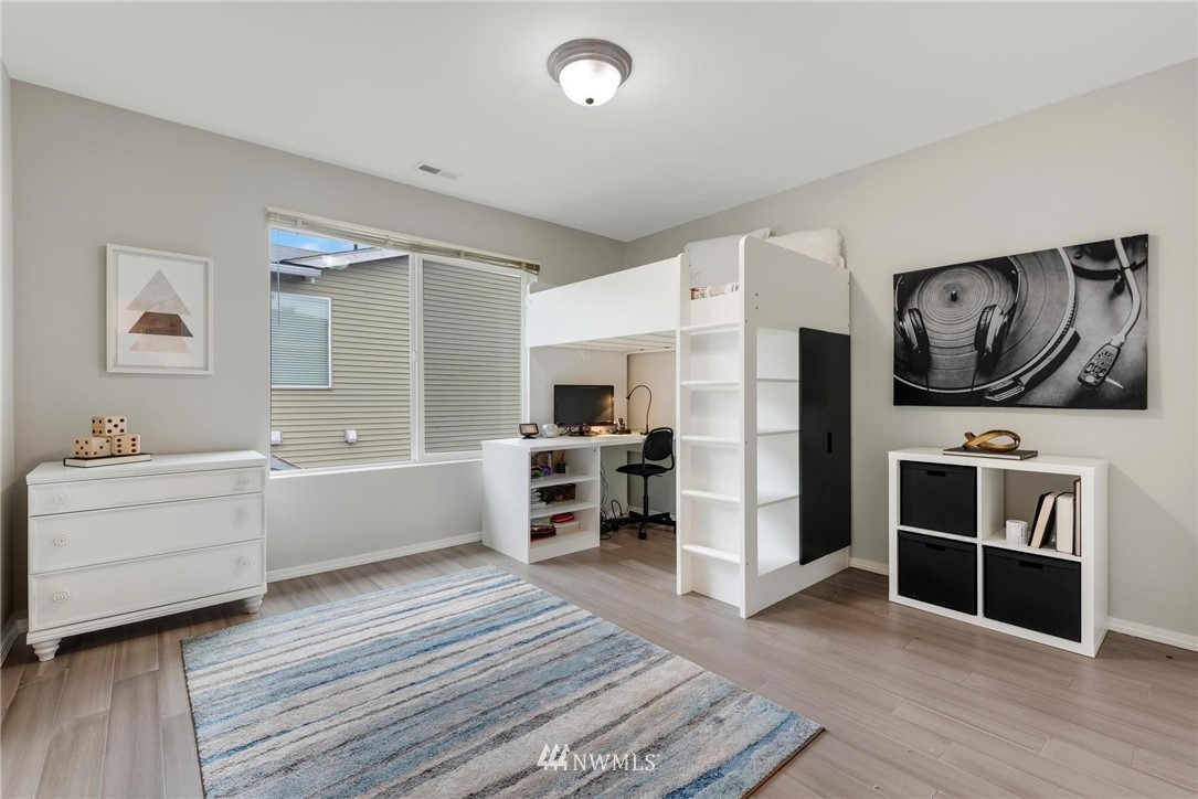 15429 38th Drive Southeast Bothell, WA 98012 - Photo 19 of 26 a large white room with wooden floor and furniture