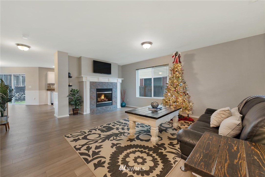 15429 38th Drive Southeast Bothell, WA 98012 - Photo 3 of 26 a living room with furniture fireplace and a fireplace