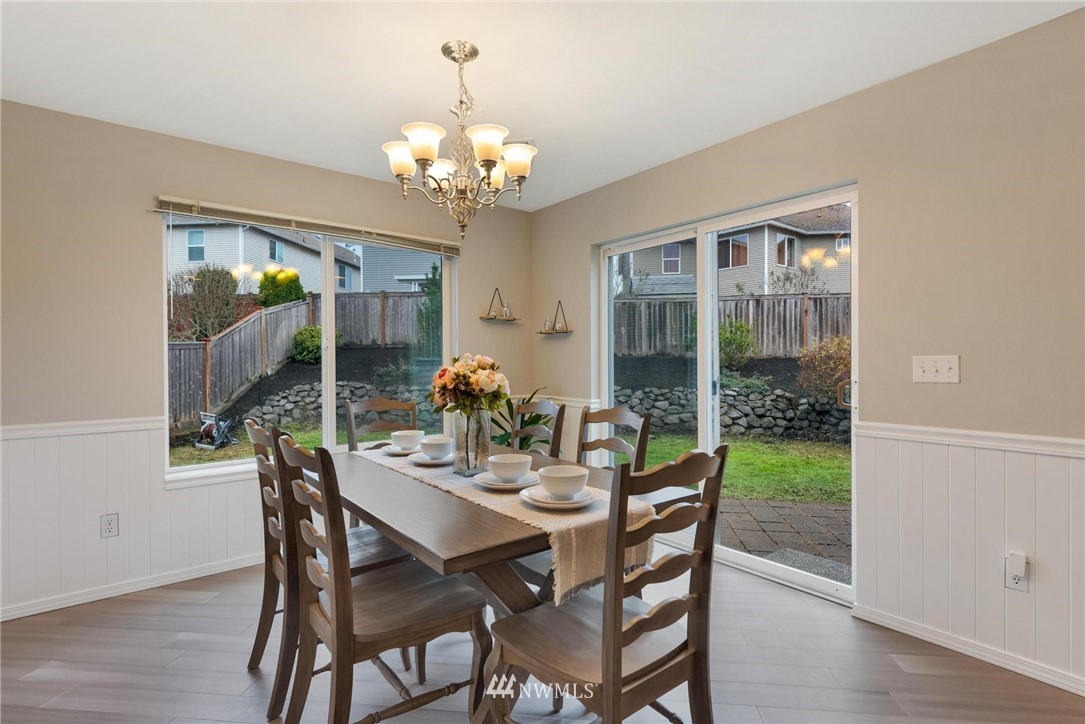 15429 38th Drive Southeast Bothell, WA 98012 - Photo 4 of 26 a view of a dining room with furniture window and wooden floor