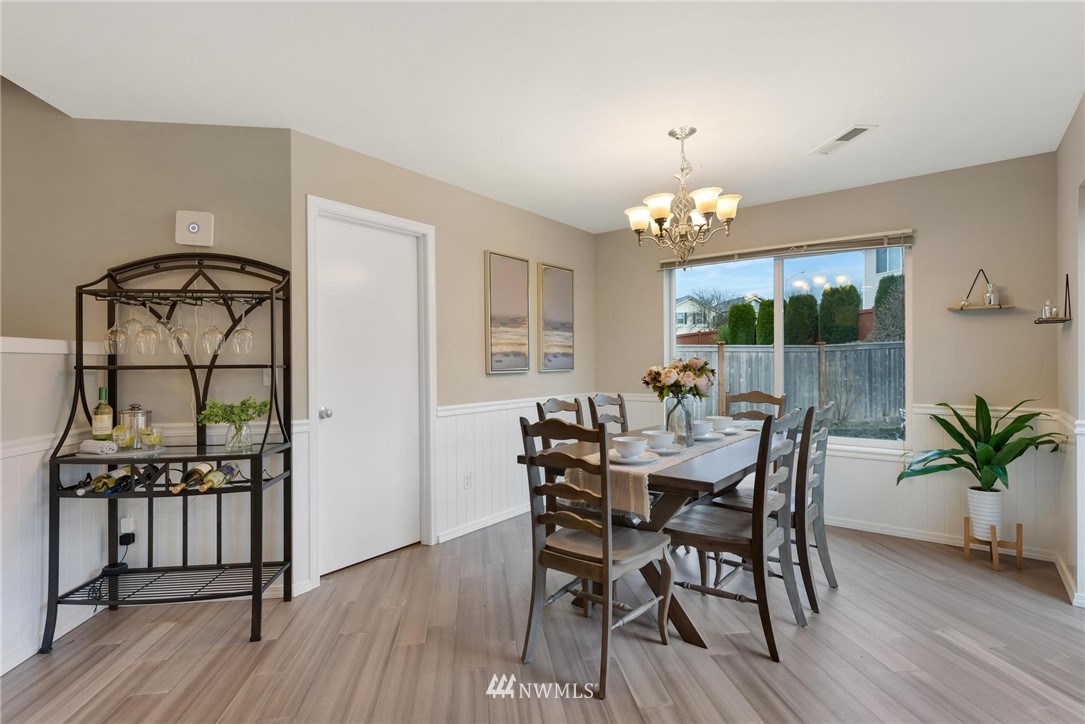 15429 38th Drive Southeast Bothell, WA 98012 - Photo 5 of 26 a view of a dining room with furniture window and wooden floor