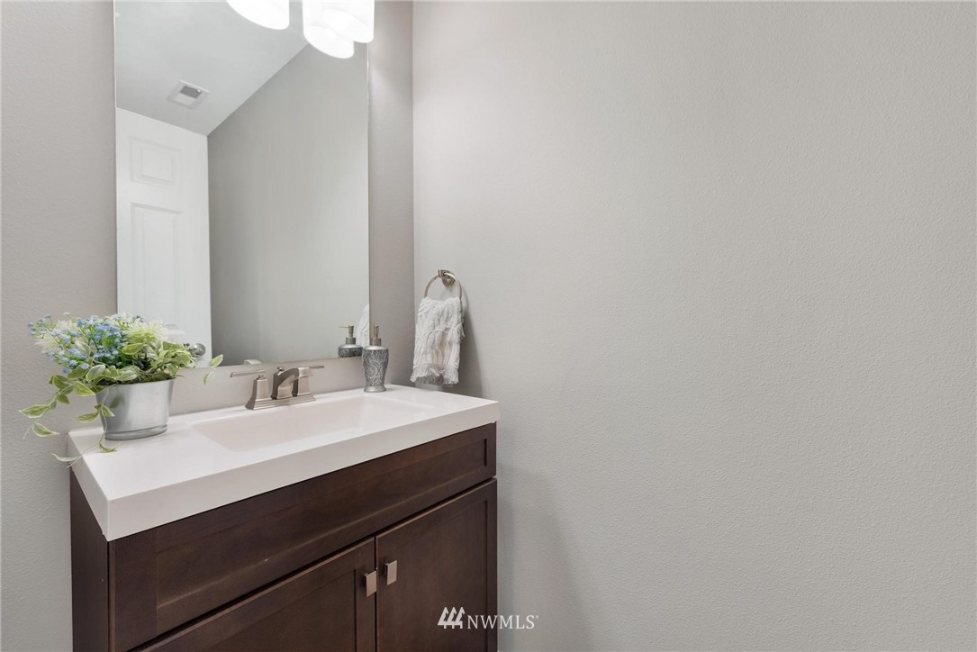15429 38th Drive Southeast Bothell, WA 98012 - Photo 10 of 26 a bathroom with a sink and a mirror