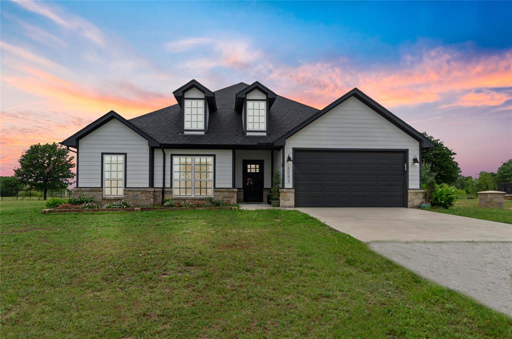 6093 Farm To Market Road 730 North Decatur, TX 76234 - Photo 1 of 28 a front view of a house with a garden