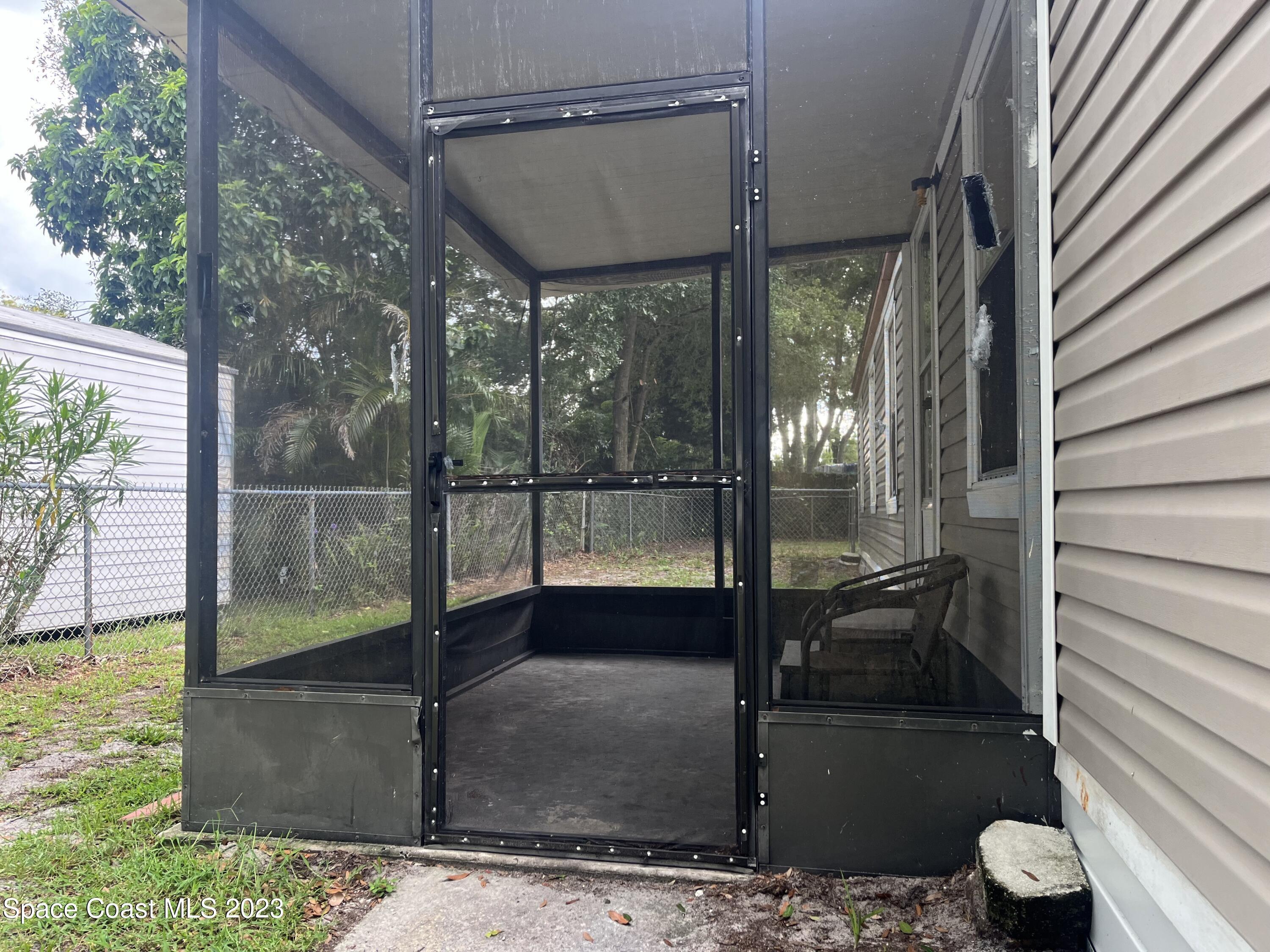 421 Cross Road Cocoa, FL 32926 - Photo 16 of 18 a porch with wooden floor