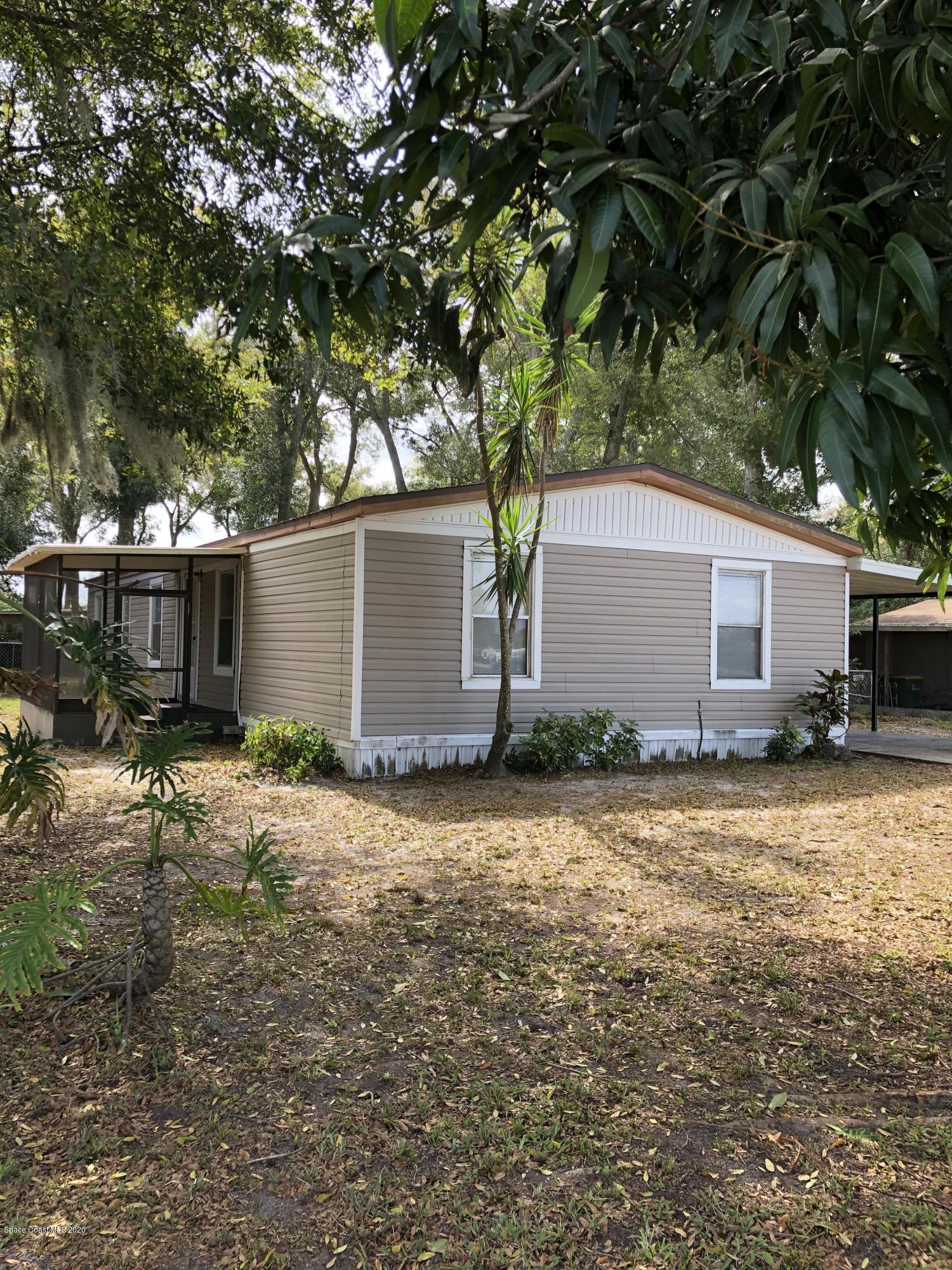 421 Cross Road Cocoa, FL 32926 - Photo 2 of 18 a backyard of a house with yard and tree