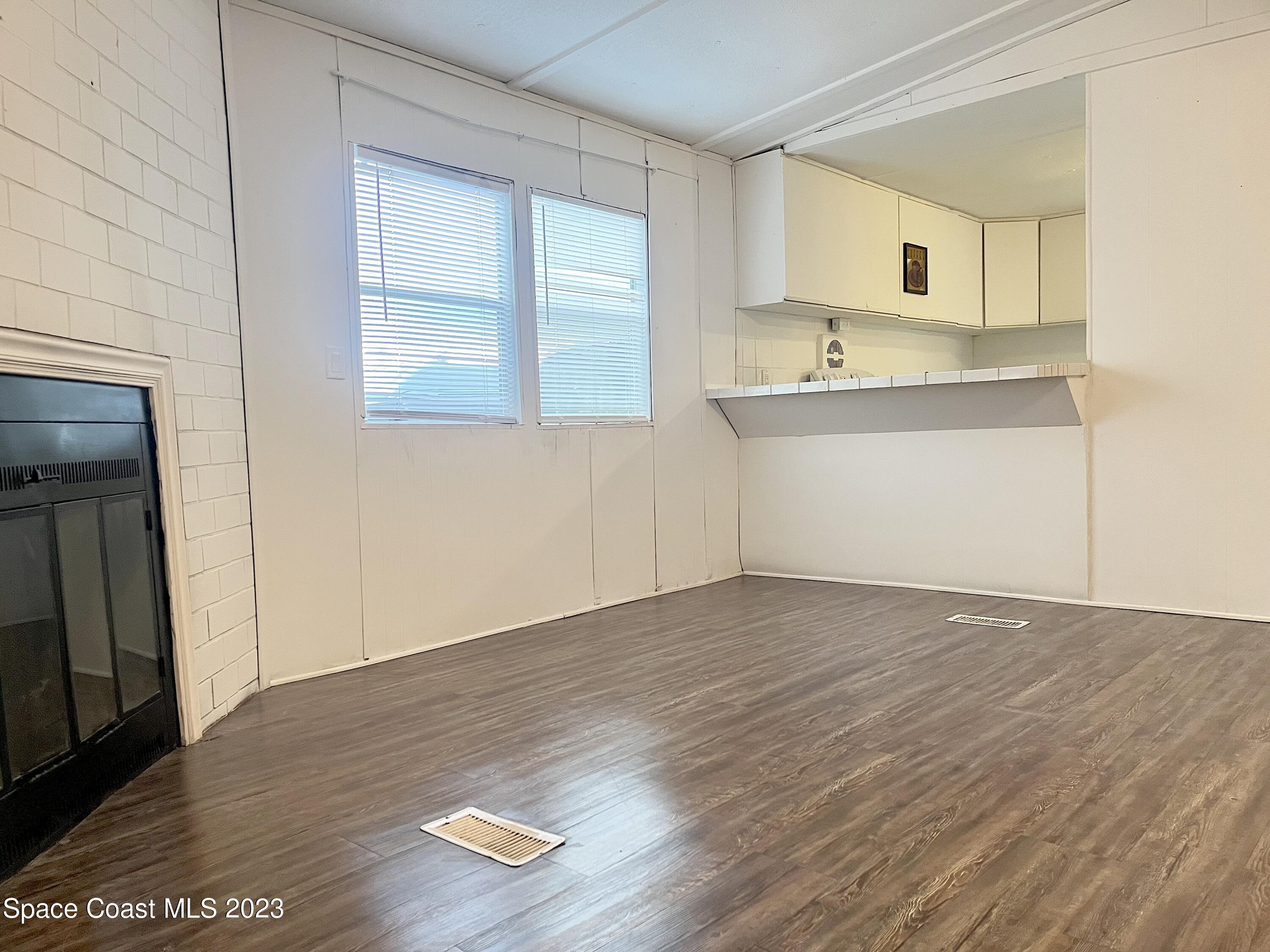 421 Cross Road Cocoa, FL 32926 - Photo 5 of 18 a view of kitchen with wooden floor and electronic appliances