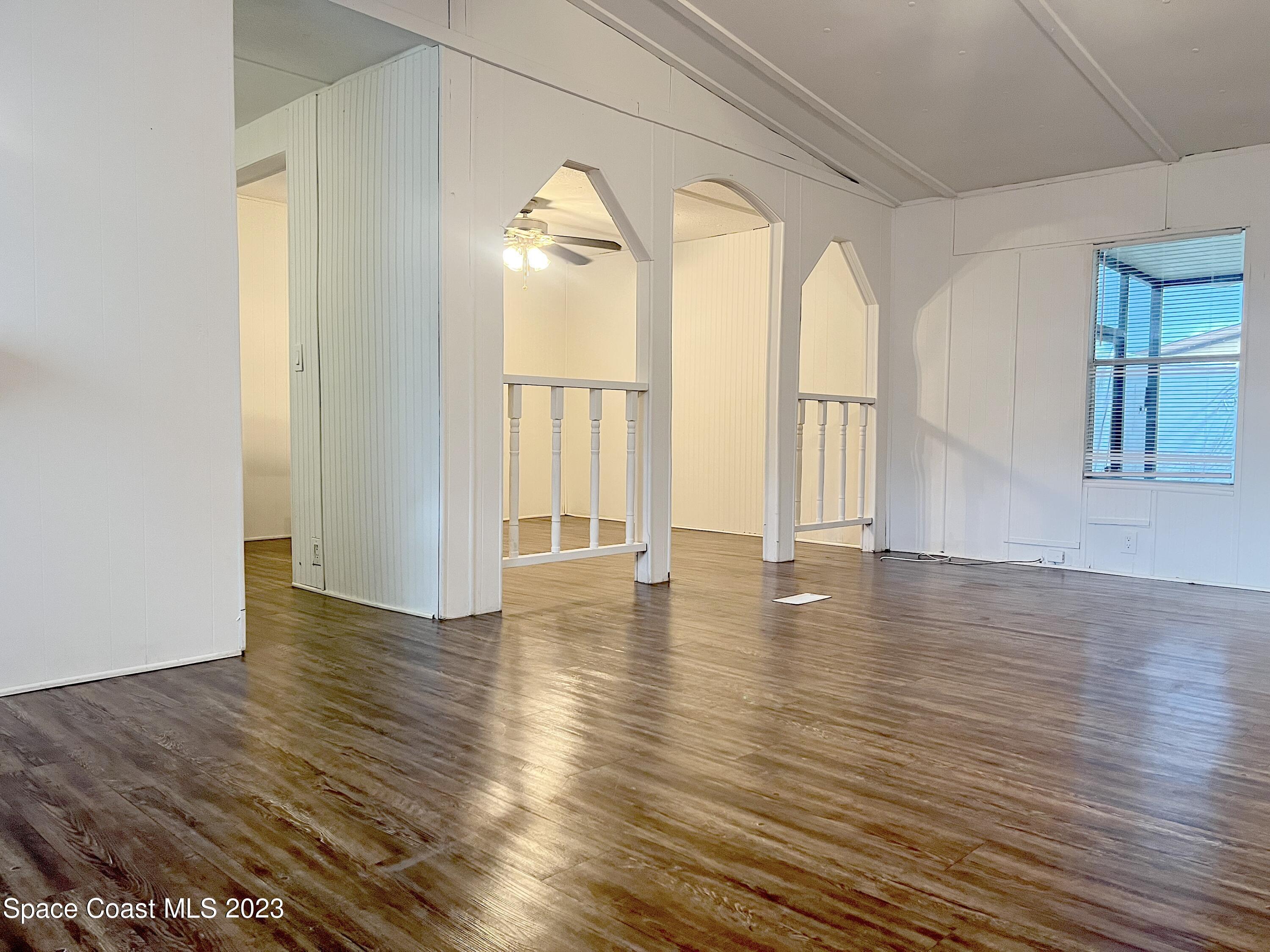 421 Cross Road Cocoa, FL 32926 - Photo 6 of 18 a view of empty room with wooden floor and fan