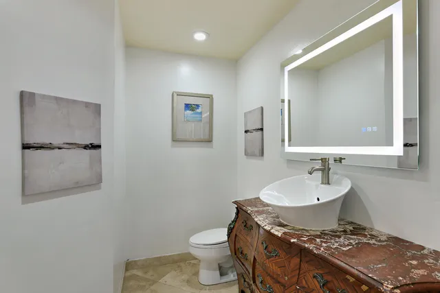 a bathroom with a shower curtain and a sink