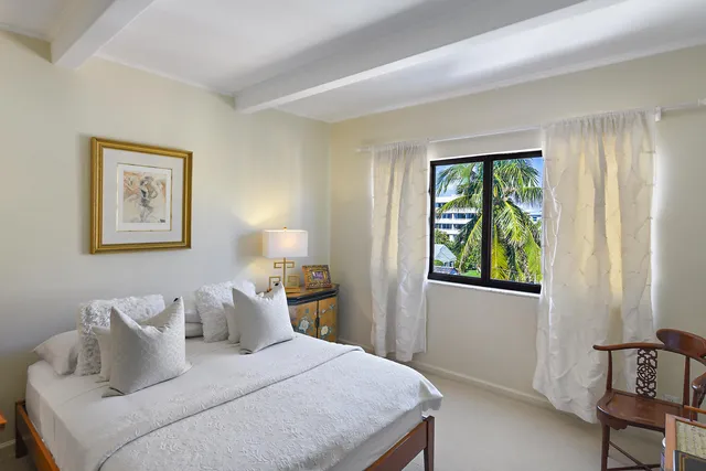 a bathroom with a toilet a sink a vanity and mirror