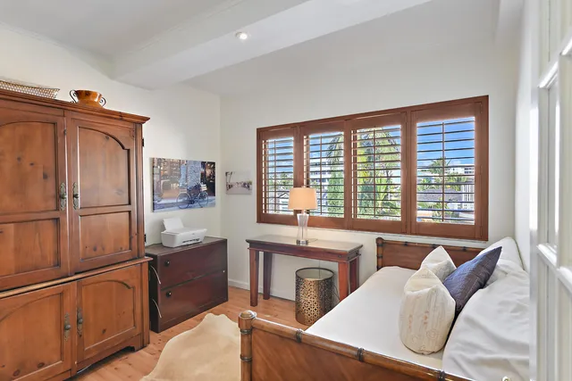 a view of walk in closet and bedroom