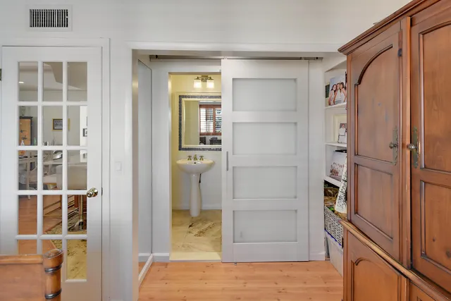 a bathroom with a toilet sink and shower