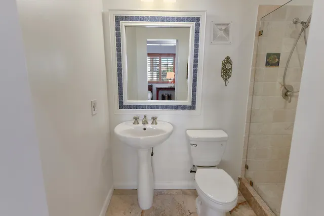 a bathroom with a shower and a sink