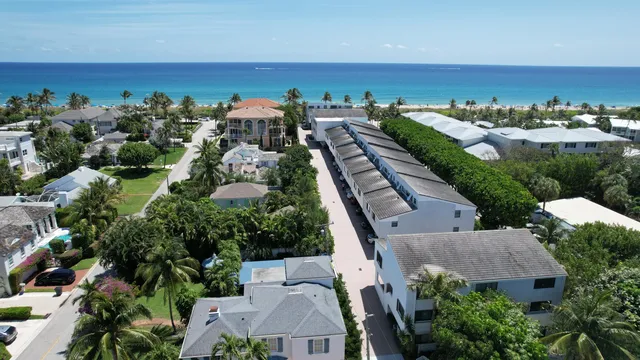 a view of a house with car parked
