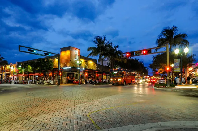 a view of a room with furniture and floor to ceiling window
