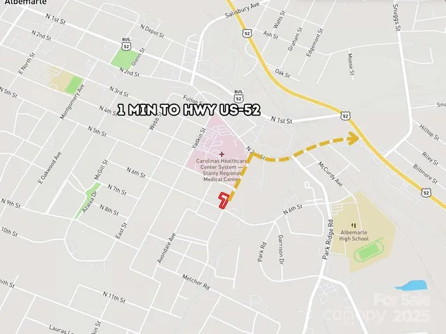 a white bath tub sitting next to a white wall