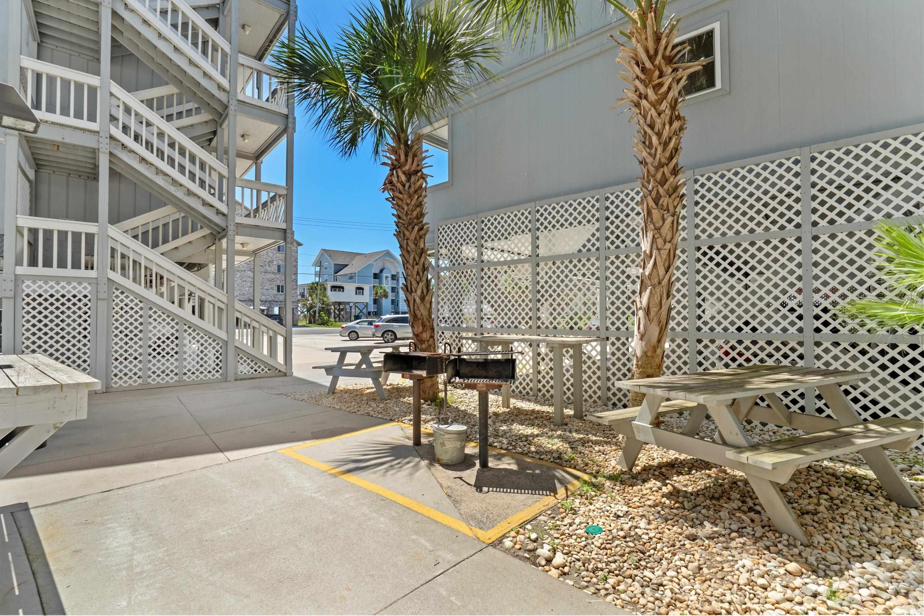 625 North Waccamaw Drive, Unit 107 Murrells Inlet, SC 29576 - Photo 26 of 37 View of patio featuring stairs