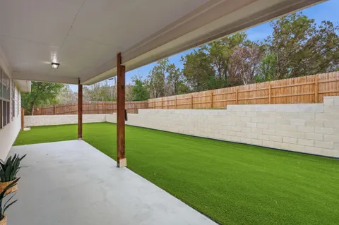 a view of a backyard with a garden and plants