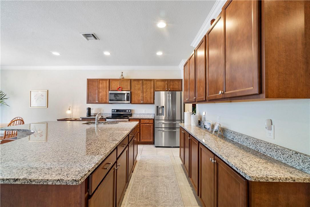 8332 Rearing Lane Lake Worth, FL 33467 - Photo 4 of 30 Granite with 42 in cabinets /crown trim