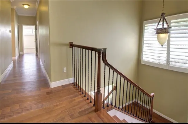 a view of a hallway with windows